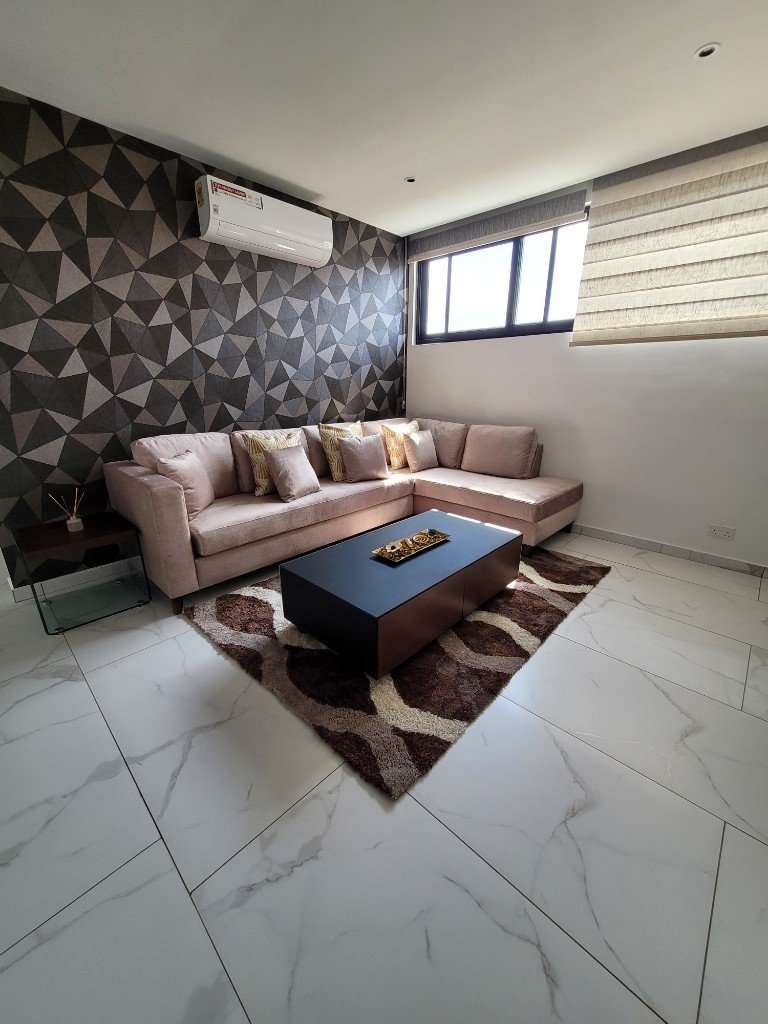 Geometric feature wall lounge by D'anges Interiors